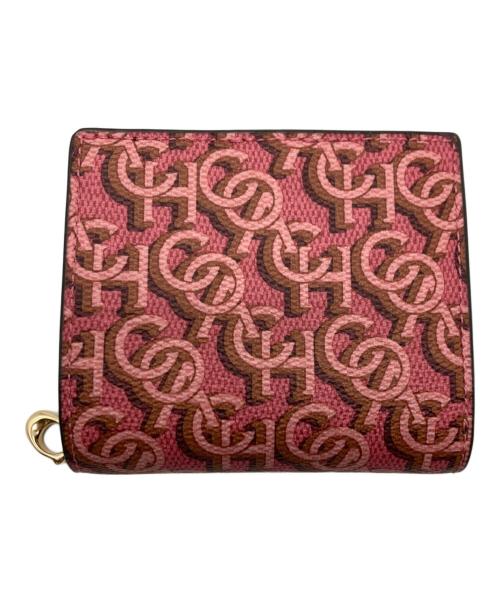 COACH（コーチ）COACH (コーチ) モノグラム2つ折り財布 ピンクの古着・服飾アイテム