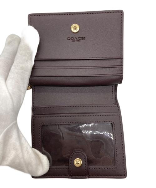 COACH（コーチ）COACH (コーチ) モノグラム2つ折り財布 ピンクの古着・服飾アイテム