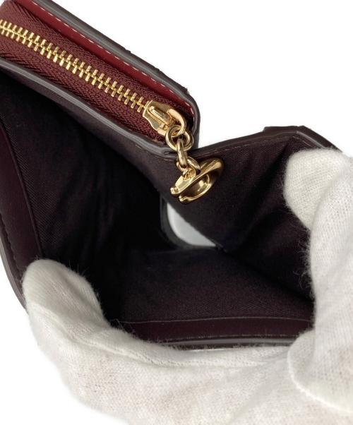 COACH（コーチ）COACH (コーチ) モノグラム2つ折り財布 ピンクの古着・服飾アイテム