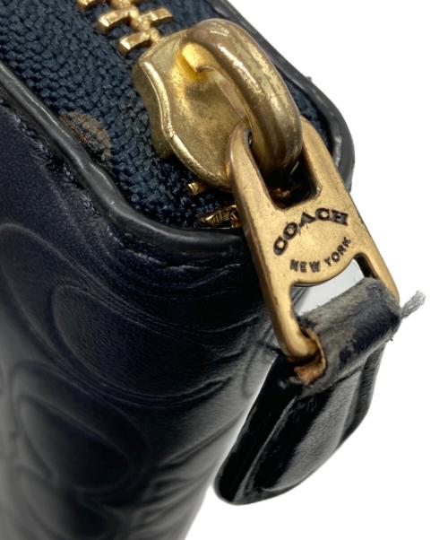 COACH（コーチ）COACH (コーチ) エンボスラウンドファスナー財布 ネイビーの古着・服飾アイテム