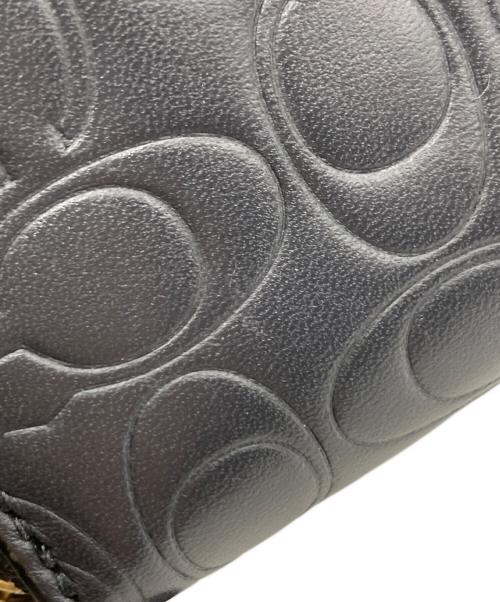 COACH（コーチ）COACH (コーチ) エンボスラウンドファスナー財布 ネイビーの古着・服飾アイテム