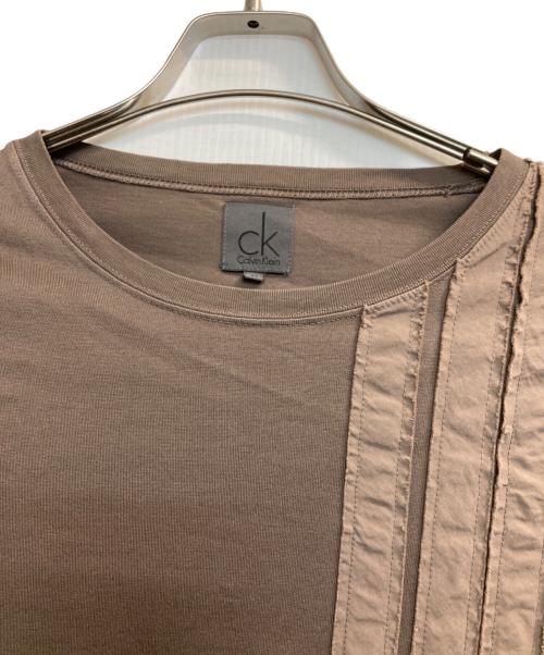 ck Calvin Klein（シーケーカルバンクライン）ck Calvin Klein (シーケーカルバンクライン) デザイン長袖Tシャツ ブラウン サイズ:Ｍの古着・服飾アイテム