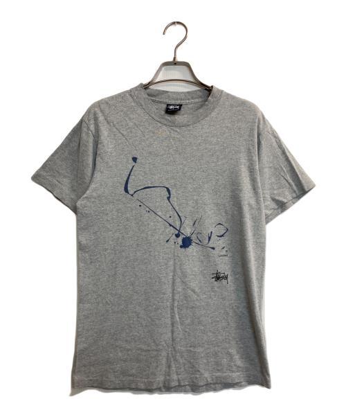 stussy（ステューシー）stussy (ステューシー) WTAPS (ダブルタップス) DRIP TECHNIQUE T-Shirt グレー サイズ:Ｓの古着・服飾アイテム