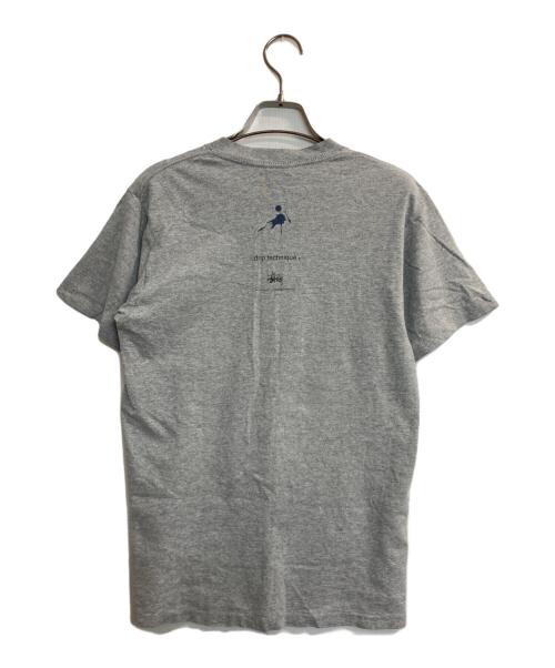 stussy（ステューシー）stussy (ステューシー) WTAPS (ダブルタップス) DRIP TECHNIQUE T-Shirt グレー サイズ:Ｓの古着・服飾アイテム