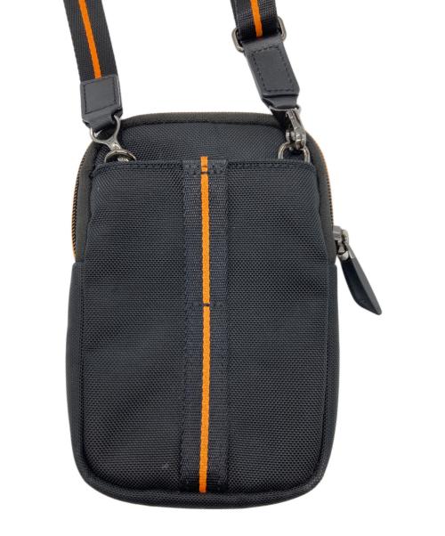 TUMI（トゥミ）TUMI (トゥミ) マクラーレンコラボミニショルダーバッグ ブラック×オレンジの古着・服飾アイテム