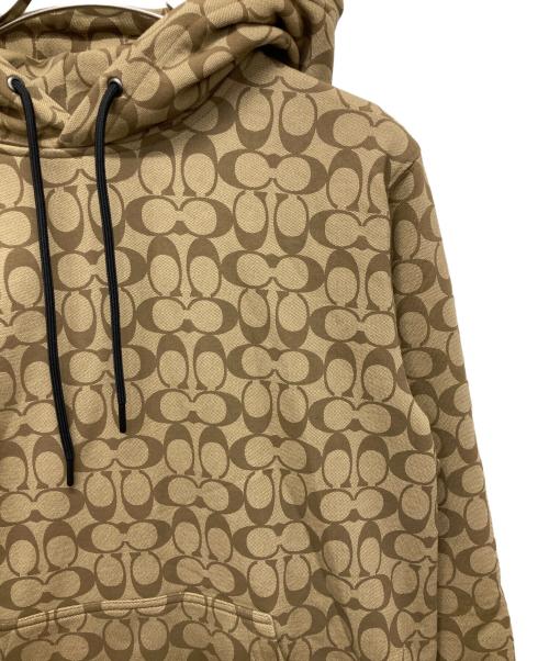 COACH（コーチ）COACH (コーチ) シグネチャープリントプルオーバーパーカー ベージュ サイズ:MEDIUMの古着・服飾アイテム