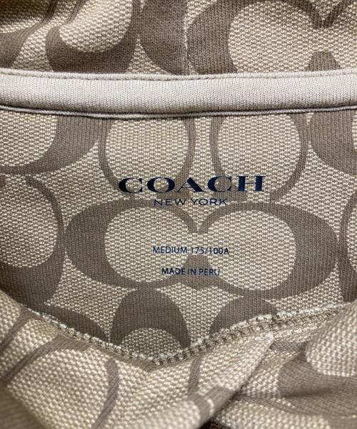 COACH（コーチ）COACH (コーチ) シグネチャープリントプルオーバーパーカー ベージュ サイズ:MEDIUMの古着・服飾アイテム