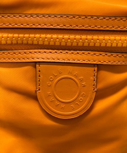 COLE HAAN（コールハーン）COLE HAAN (コールハーン) ナイロンドローストリングクロスボディバッグ オレンジの古着・服飾アイテム