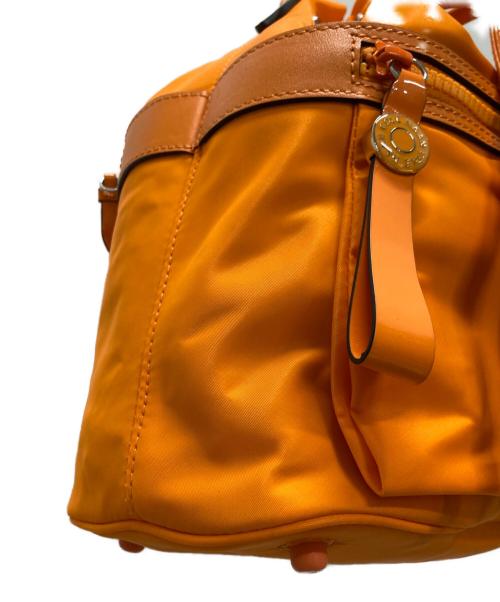 COLE HAAN（コールハーン）COLE HAAN (コールハーン) ナイロンドローストリングクロスボディバッグ オレンジの古着・服飾アイテム