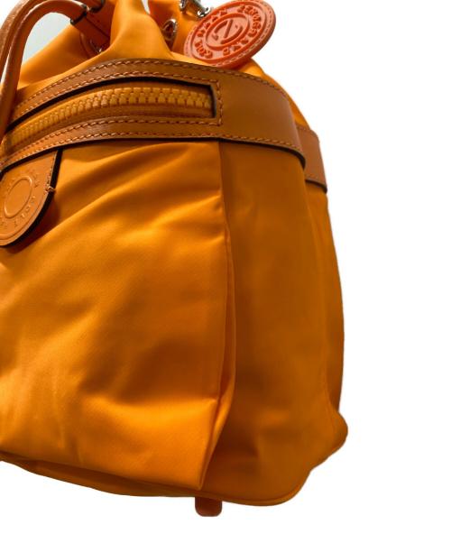 COLE HAAN（コールハーン）COLE HAAN (コールハーン) ナイロンドローストリングクロスボディバッグ オレンジの古着・服飾アイテム