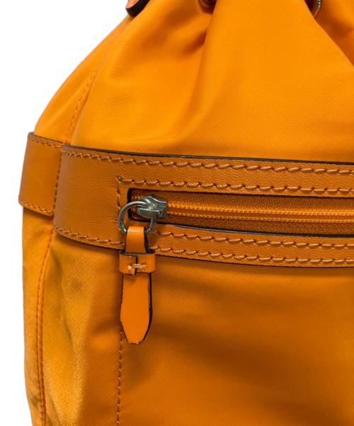 COLE HAAN（コールハーン）COLE HAAN (コールハーン) ナイロンドローストリングクロスボディバッグ オレンジの古着・服飾アイテム