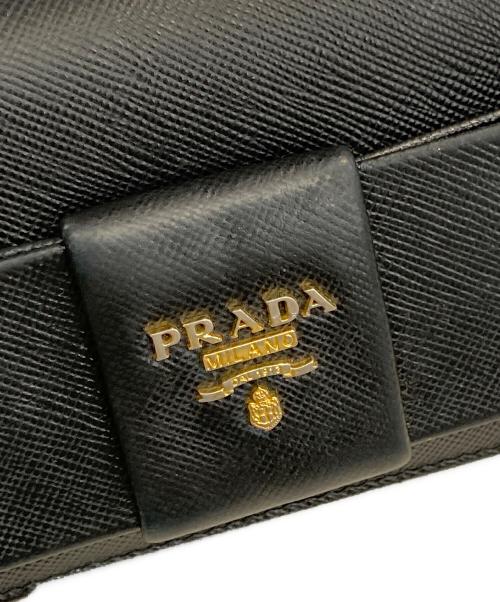 PRADA（プラダ）PRADA (プラダ) サフィアーノ フィオッコ リボン長財布 ブラックの古着・服飾アイテム