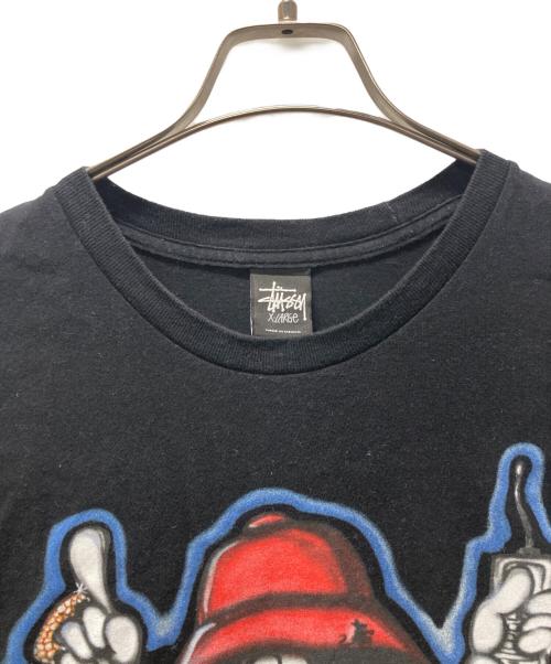 stussy（ステューシー）stussy (ステューシー) SHIRT KING PHADE (シャツキングフェイド) 8BALL MAN プリントTシャツ ブラック サイズ:XLの古着・服飾アイテム
