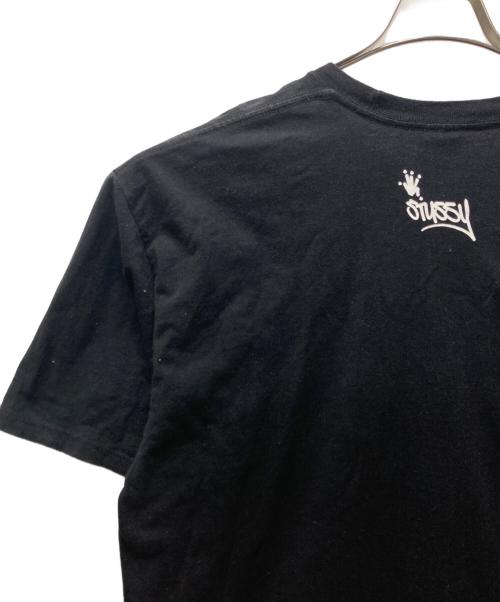stussy（ステューシー）stussy (ステューシー) SHIRT KING PHADE (シャツキングフェイド) 8BALL MAN プリントTシャツ ブラック サイズ:XLの古着・服飾アイテム