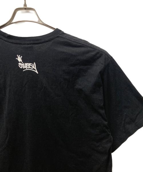 stussy（ステューシー）stussy (ステューシー) SHIRT KING PHADE (シャツキングフェイド) 8BALL MAN プリントTシャツ ブラック サイズ:XLの古着・服飾アイテム