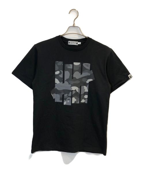 A BATHING APE（ア ベイシング エイプ）A BATHING APE (ア ベイシング エイプ) UNDEFEATED (アンディフィーテッド) プリントTシャツ ブラック サイズ:Mの古着・服飾アイテム