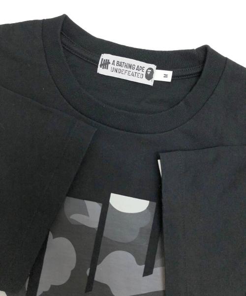 A BATHING APE（ア ベイシング エイプ）A BATHING APE (ア ベイシング エイプ) UNDEFEATED (アンディフィーテッド) プリントTシャツ ブラック サイズ:Mの古着・服飾アイテム