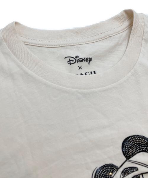 COACH（コーチ）COACH (コーチ) Disney (ディズニー) スパンコールＴシャツ ベージュ サイズ:Sの古着・服飾アイテム
