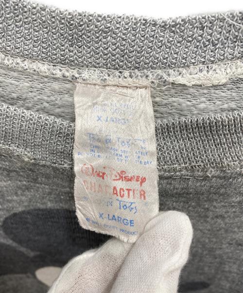 DISNEY（ディズニー）DISNEY (ディズニー) 染み込みプリント ヴィンテージラグランスウェット グレー サイズ:XLの古着・服飾アイテム