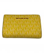 MICHAEL KORSマイケル・コース）の古着「2つ折り財布」｜イエロー