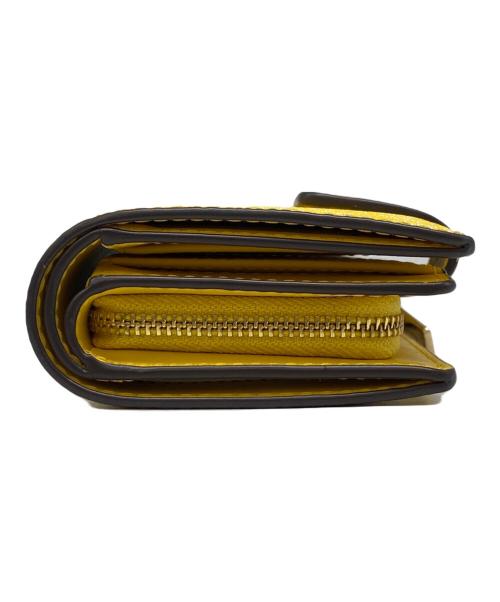 MICHAEL KORS（マイケル・コース）MICHAEL KORS (マイケルコース) 2つ折り財布 イエローの古着・服飾アイテム