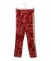 Palm Angels（パーム エンジェルス）の古着「バンダナ柄トラックパンツ」｜レッド
