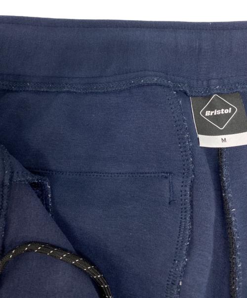 F.C.Real Bristol（エフシーレアルブリストル）F.C.Real Bristol (エフシーレアルブリストル) MLB TOUR FLAT HEM TRAINING PANTS ネイビー サイズ:Mの古着・服飾アイテム