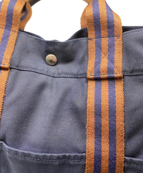 HERMES（エルメス）HERMES (エルメス) キャンバストートバッグ オレンジ×ネイビーの古着・服飾アイテム