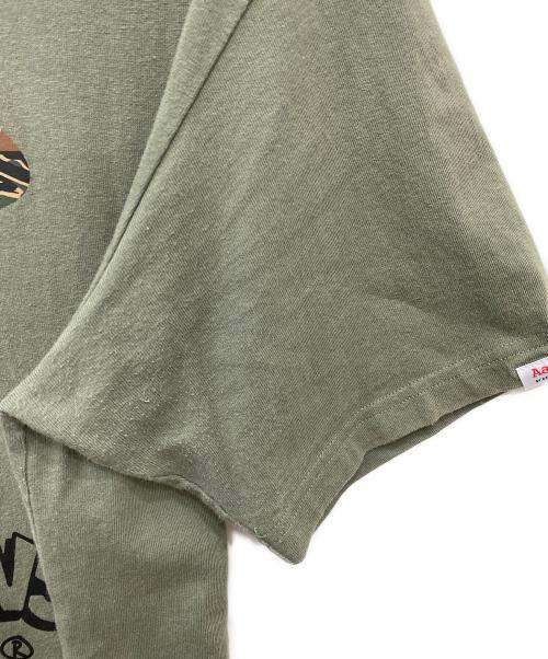 A BATHING APE（アベイシングエイプ）A BATHING APE (アベイシングエイプ) プリントTシャツ カーキ サイズ:XLの古着・服飾アイテム