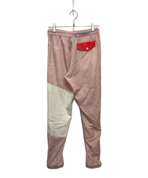 KITH（キス）KITH (キス) Columbia (コロンビア) コラボナイロンパンツ ピンク×ホワイト サイズ:Sの古着・服飾アイテム