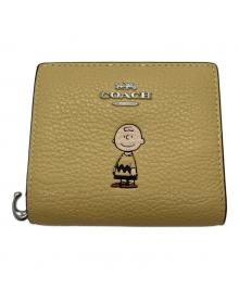 COACH×PEANUTS（コーチ×ピーナッツ）の古着「スナップウォレット・チャーリー・ブラウン」｜イエロー