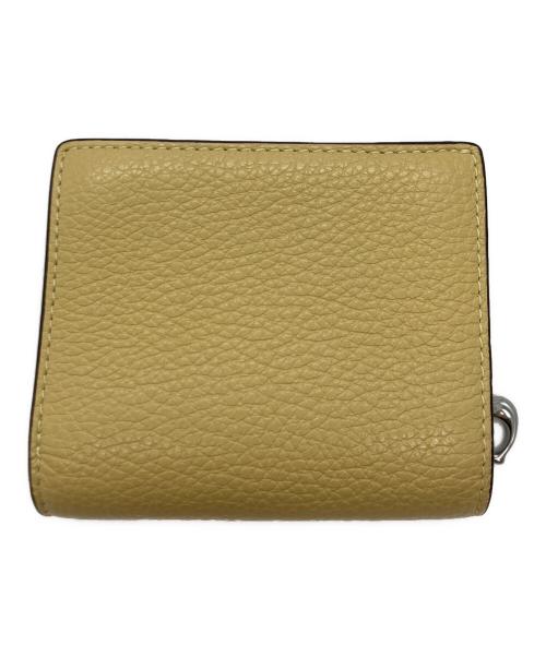 COACH（コーチ）COACH (コーチ) PEANUTS (ピーナッツ) スナップウォレット・チャーリー・ブラウン イエローの古着・服飾アイテム