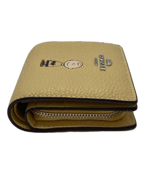 COACH（コーチ）COACH (コーチ) PEANUTS (ピーナッツ) スナップウォレット・チャーリー・ブラウン イエローの古着・服飾アイテム