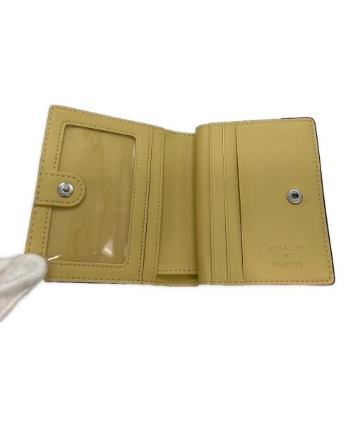 COACH（コーチ）COACH (コーチ) PEANUTS (ピーナッツ) スナップウォレット・チャーリー・ブラウン イエローの古着・服飾アイテム