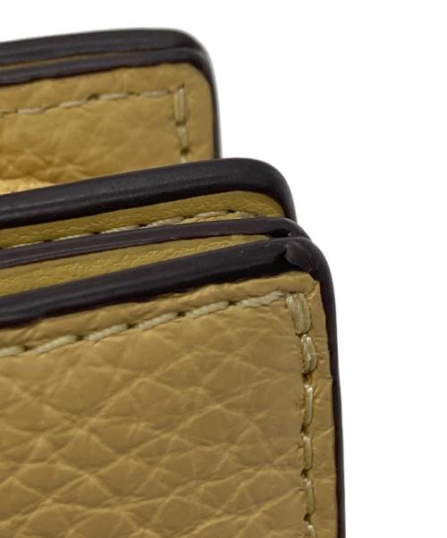 COACH（コーチ）COACH (コーチ) PEANUTS (ピーナッツ) スナップウォレット・チャーリー・ブラウン イエローの古着・服飾アイテム