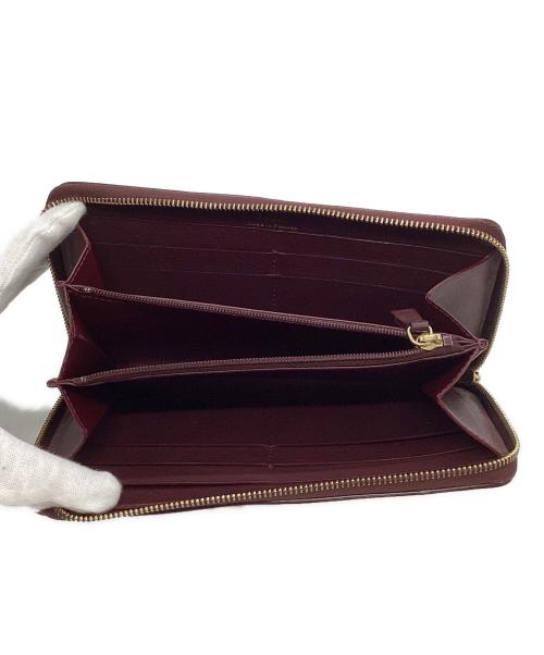 Cartier（カルティエ）Cartier (カルティエ) マスト ドゥ カルティエ ラウンドジップインターナショナル ウォレット バーガンディーの古着・服飾アイテム