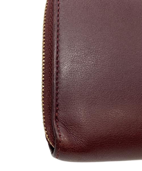 Cartier（カルティエ）Cartier (カルティエ) マスト ドゥ カルティエ ラウンドジップインターナショナル ウォレット バーガンディーの古着・服飾アイテム