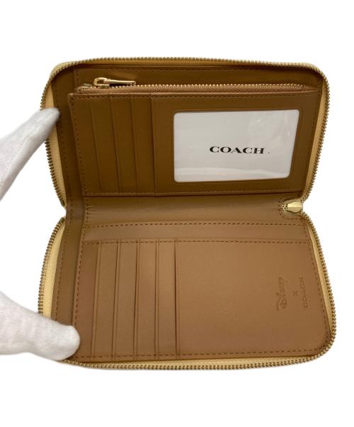 COACH（コーチ）COACH (コーチ) Disney (ディズニー) ラウンドファスナー長財布 イエローの古着・服飾アイテム