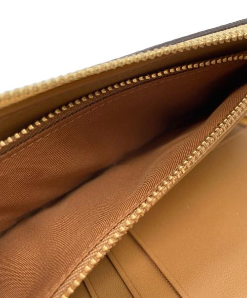 COACH（コーチ）COACH (コーチ) Disney (ディズニー) ラウンドファスナー長財布 イエローの古着・服飾アイテム