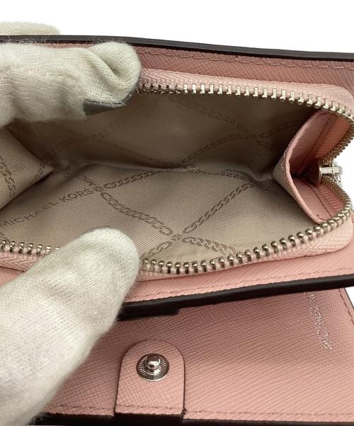 MICHAEL KORS（マイケルコース）MICHAEL KORS (マイケルコース) 2つ折り財布 ピンクの古着・服飾アイテム
