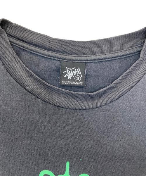 stussy（ステューシー）stussy (ステューシー) UNDEFEATED (アンディフィーテッド) ペイントTee ブラック サイズ:XLの古着・服飾アイテム