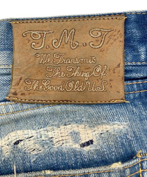 TMT（ティーエムティー）TMT (ティーエムティー) ワッペン付きセルビッチデニムパンツ インディゴ サイズ:Mの古着・服飾アイテム