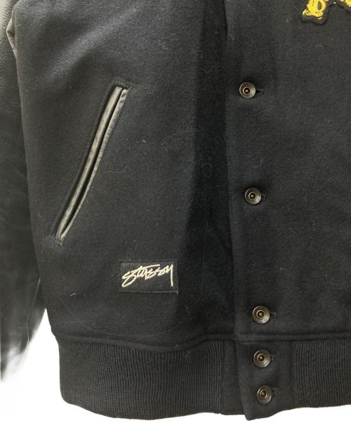 stussy（ステューシー）stussy (ステューシー) nexus7 (ネクサスセブン) ライオン刺繍スタジャン ブラック サイズ:Lの古着・服飾アイテム