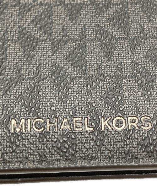 MICHAEL KORS（マイケル・コース）MICHAEL KORS (マイケル・コース) GREYSON ビルフォールド ウィズ コイン ポケット - MKシグネチャー ブラックの古着・服飾アイテム