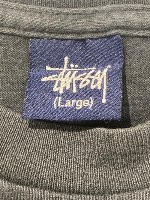 stussy（ステューシー）stussy (ステューシー) Dinosaur T-Shirt ブラック サイズ:Lの古着・服飾アイテム
