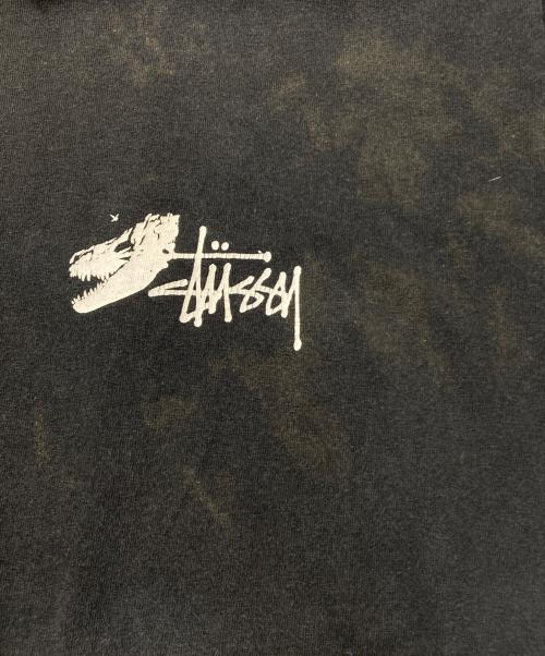 stussy（ステューシー）stussy (ステューシー) Dinosaur T-Shirt ブラック サイズ:Lの古着・服飾アイテム