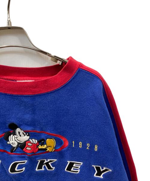 Disney STORE（ディズニーストア）Disney STORE (ディズニーストア) 刺繍ロゴクルーネックスウェット レッド×ブルー サイズ:Lの古着・服飾アイテム