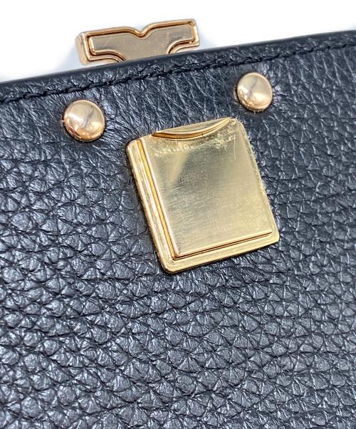 TORY BURCH（トリーバーチ）TORY BURCH (トリーバーチ) ロゴバックルフラップロングウォレット ブラックの古着・服飾アイテム