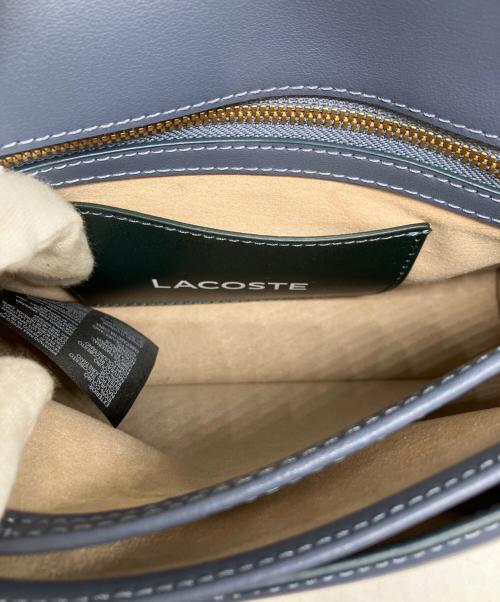 LACOSTE（ラコステ）LACOSTE (ラコステ) テニスボールモチーフフラップバッグ ブルーの古着・服飾アイテム
