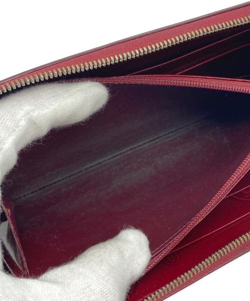 Cartier（カルティエ）Cartier (カルティエ) パテントファスナーウォレット レッドの古着・服飾アイテム